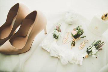 Fototapeta na wymiar White stylish wedding shoes for bride. Close-up