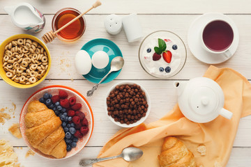 Continental breakfast menu on woden table