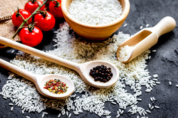ingredients for paella on dark background