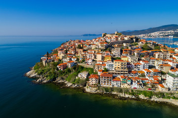 Aerial view the city of Kavala in northern Greek, ancient aqueduct Kamares, homes and medieval city wall