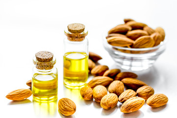 cosmetic and therapeutic almond oil on white background