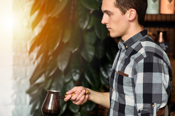 Man with coffee cup do his job on coffee place