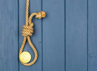 End of bitcoin. Coin bitcoin in the loop of the gallows.