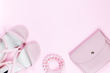 woman fashion accessories in pink color on pastel background.