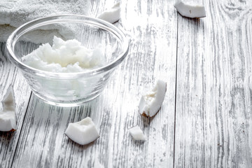 organic cosmetics with coconut on wooden background close up