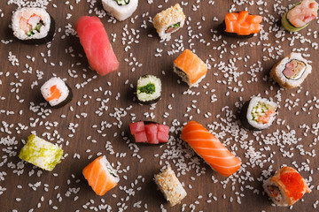 Assortment of colorful sushi and rolls background
