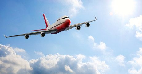 Front view of airplane flying through clouds.