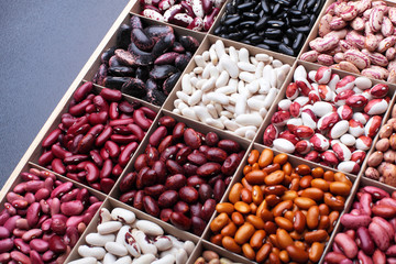 Different types of legumes beans. In wooden box.Varieties of beans.Top view.Closeup.Texture