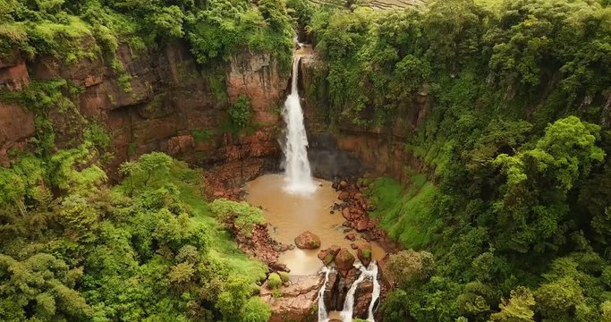 Bird's eye view of beautiful landscape of Cimarinjung waterfall at Ciletuh Geopark, Sukabumi, West Java, Indonesia. Shot in 4k resolution