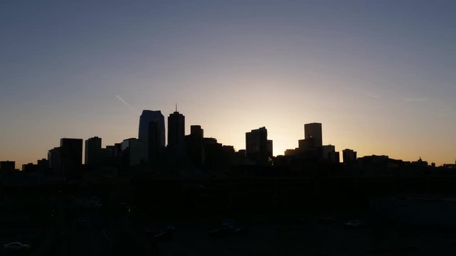 Denver Colorado skyline night to day sunrise timelapse. Zoom in, 4K UHD.
