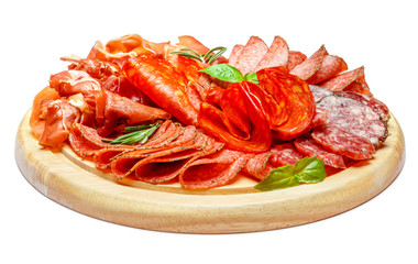 Cold meat plate with salami and chorizo sausage on wooden board