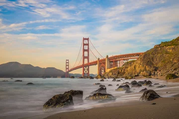 Photo sur Plexiglas Plage de Baker, San Francisco Long exposure when the sun goes down to the Golden Gate Bridge of San Francisco
