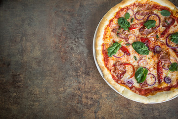 Top of wiev italian pizza on table in pizzeria
