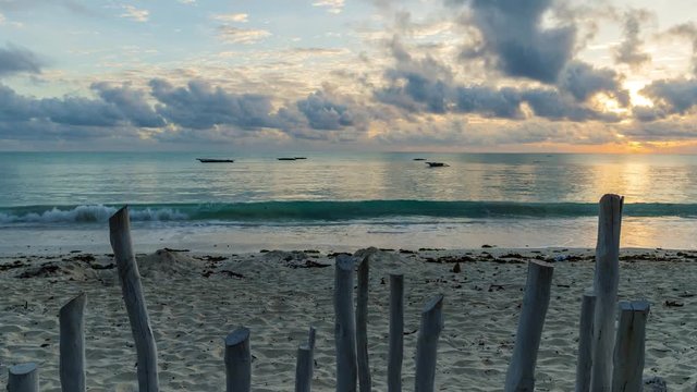 4K Time lapse moving. Beautiful tropical beach and ocean landscape at sunrise time. Uhuru beach, Zanzibar.  