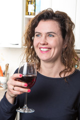 blue eyes woman drinking a glass of wine