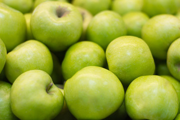 fresh green apples close up with shallow depth of field
