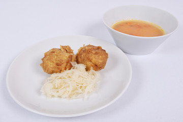 Millets potatoes dumplings with tempeh on a white