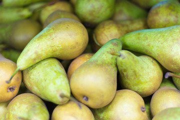 fresh pears varieties conference on display in the supermarket