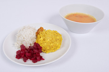 Cauliflower with turmeric and rice on a white
