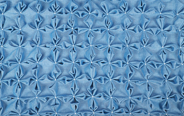 Close up background of blue textile puffs