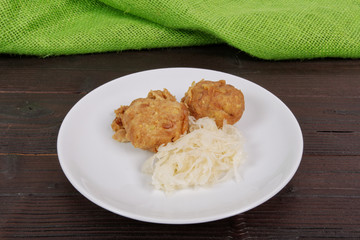 Millets potatoes dumplings with tempeh on a table