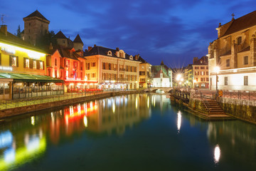 Fototapeta na wymiar Thiou river during morning blue hour in old city of Annecy, Venice of the Alps, France