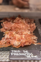 An assortment of hams in Mercado da Ribeira in Lisbon, Portugal