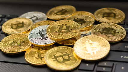Bitcoin cryptocurrency or ethereum coin Put on the computer in the business concept of financial investment through the Internet network in the virtual digital world, affecting the global economy.