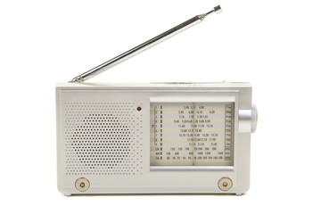 Silver colored small world radio with antenna isolated on a white background
