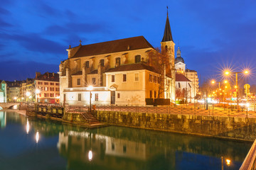 Church of Saint Francois de Sales and Thiou river during morning blue hour in old city of Annecy, Venice of the Alps, France