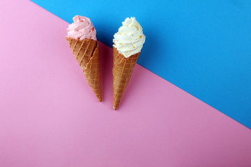 Vanilla frozen yogurt or soft ice cream in waffle cone.
