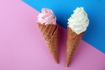 Vanilla frozen yogurt or soft ice cream in waffle cone.