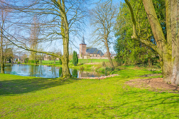 Church on a hill in a green meadow in spring