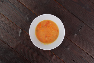 Bean soup with millets and vegetables on a table