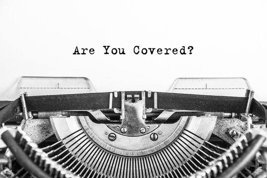 Are You Covered? The text is typed on paper by an old typewriter, a vintage thing.