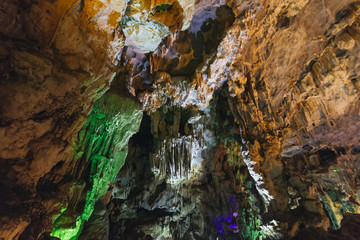 Inside Dong Thien Cung Cave that decorated with artificial green lights at Ha Long Bay. Quang Ninh, Vietnam.