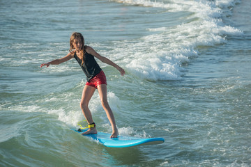 Young girl surfing