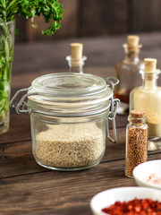 Spices and herbs. Variety of spices and herbs on a wooden surface