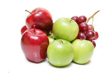 Heap of different fruits apple and grape isolated on white background