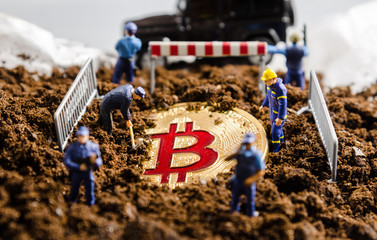 Fototapeta na wymiar miniature miner workers team digging gold bitcoin with policeman officers stand watch over. digital virtual cryptocurrency money blockchain concept