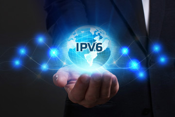 Business, Technology, Internet and network concept. Young businessman working on a virtual screen of the future and sees the inscription: IPv6