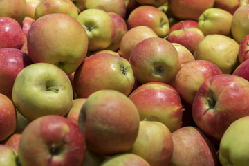Big red apples in the store. Many red apples in mall on sale closeup shot natural color image. Healthy and natural foods with high fiber content.