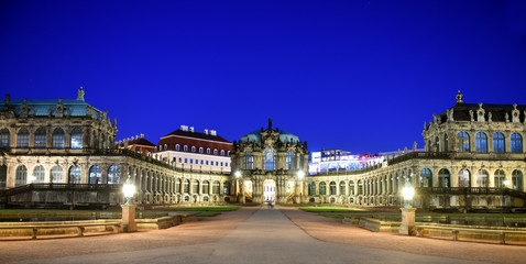 Panorama of Dresden Zwinger Palace in Rococo style at night with reflection in water bassin, Dresden, Saxony, Eastern Germany 
