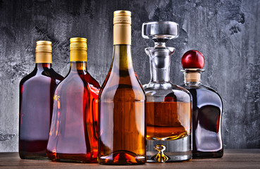 Carafe and bottles of assorted alcoholic beverages.