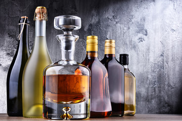 Carafe and bottles of assorted alcoholic beverages.