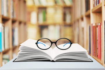 Books and glasses in the library