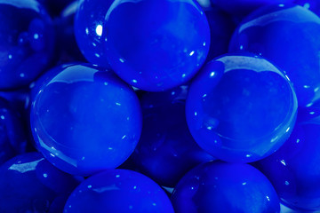 Blue balls in a glass