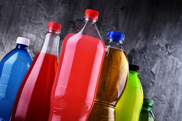 Plastic bottles of assorted carbonated soft drinks