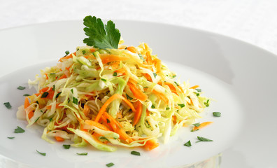 cabbage, carrot, and parsley salad dressed with lemon juice and olive oil