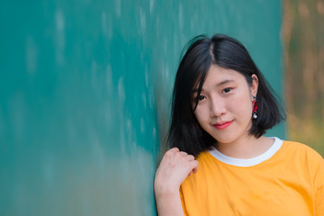 Fototapeta premium Portrait of beautiful asian chic girl pose for take a picture,Lifestyle of teen thailand people,Modern woman happy concept,Tennis couse, pastel tone